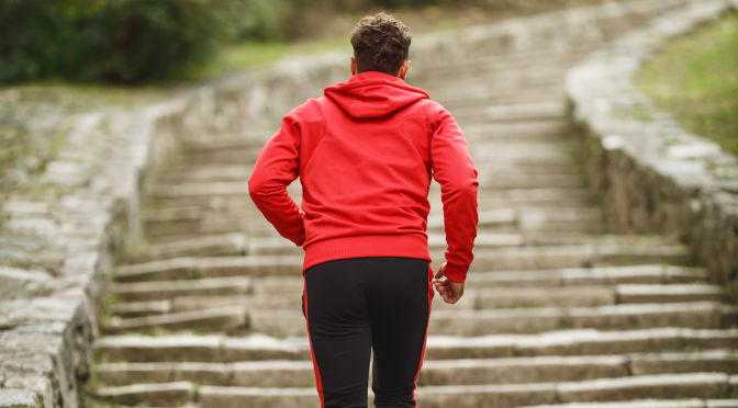 Man running up steps