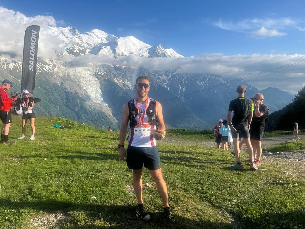 A male runner with a mountain backdrop