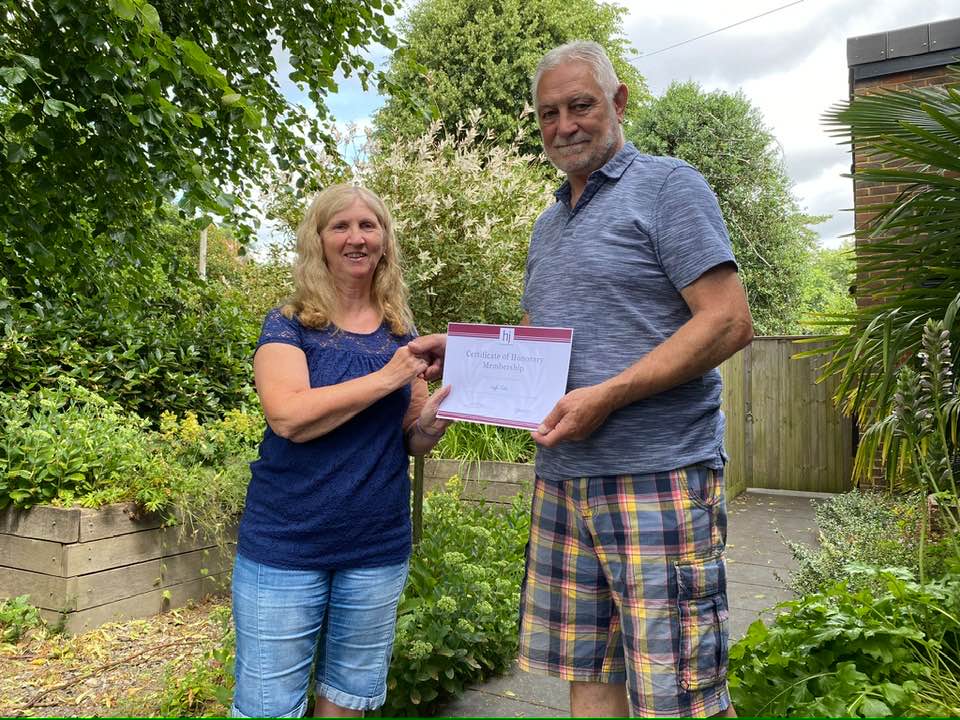 Diane Berry presenting Honorary Member certificate to Geoff Parker