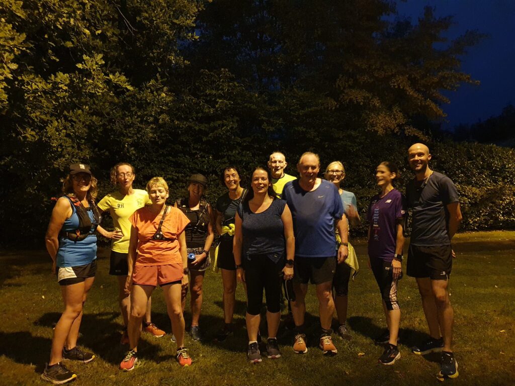 A group of runners at night