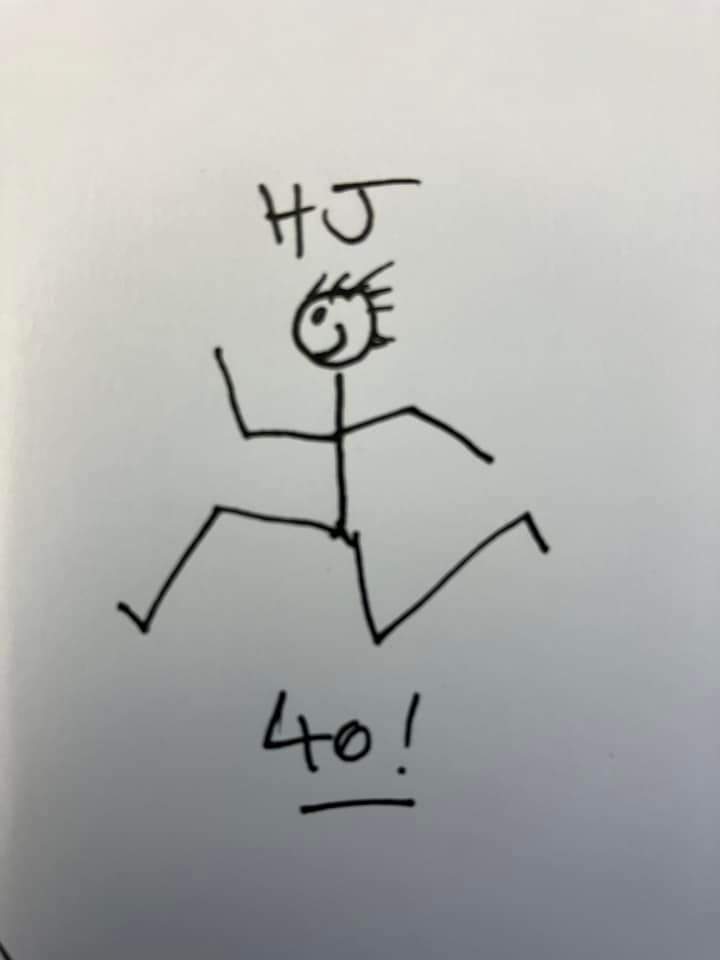 A stick man drawing of a person running