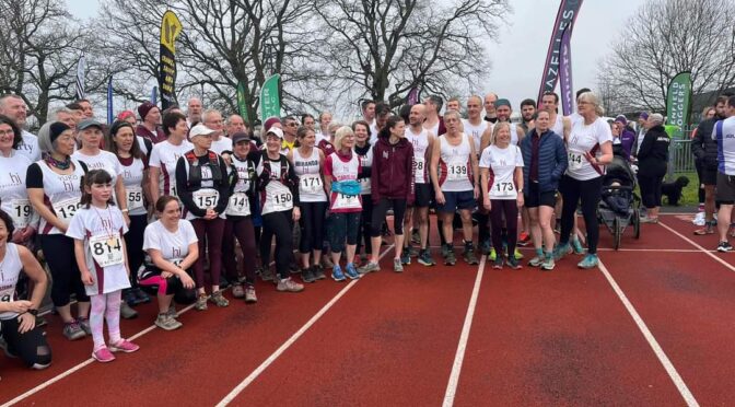 A group of runners on a running track