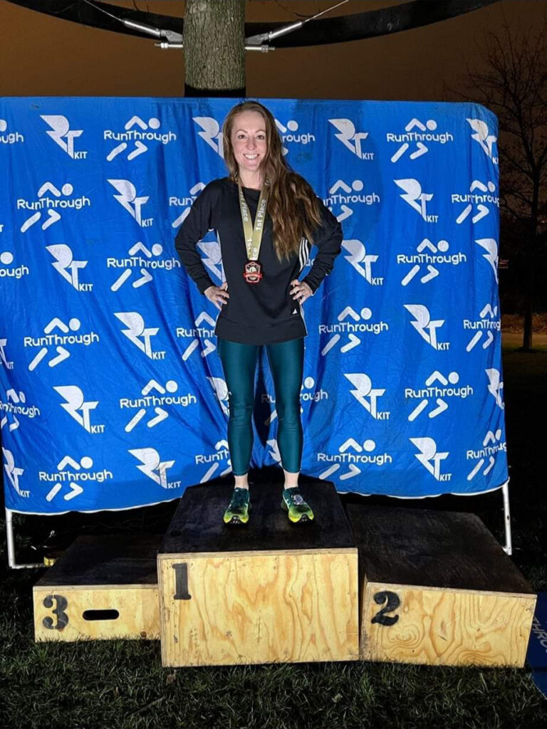 A woman on a winners podium