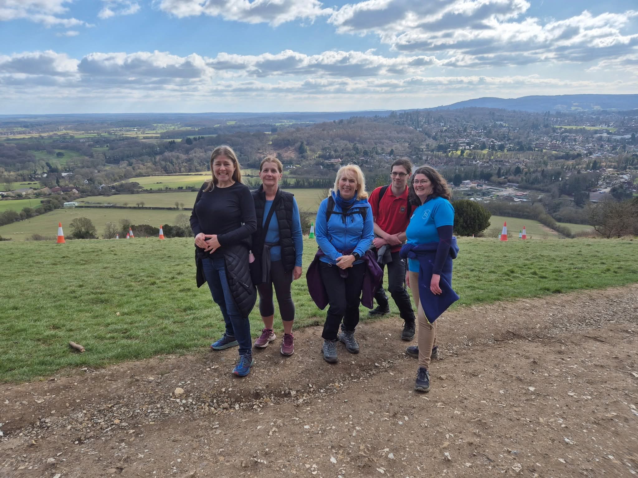 A group of five people on a hillside