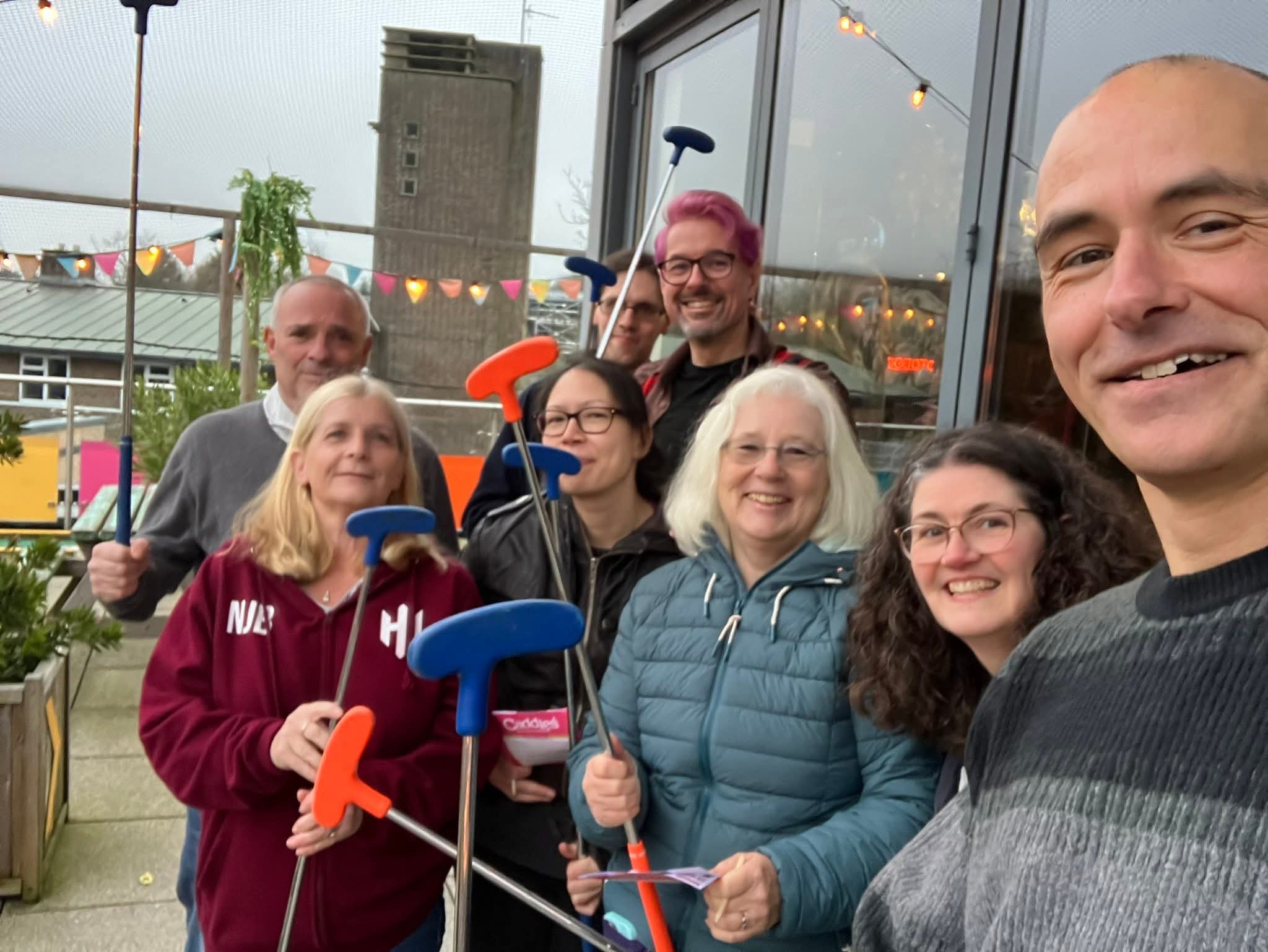 A group of people with golf clubs