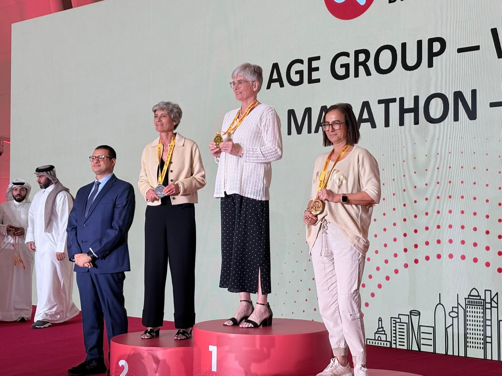 A group of people standing on podiums at a prize ceremony