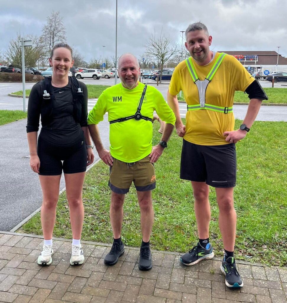 Three people in running kit