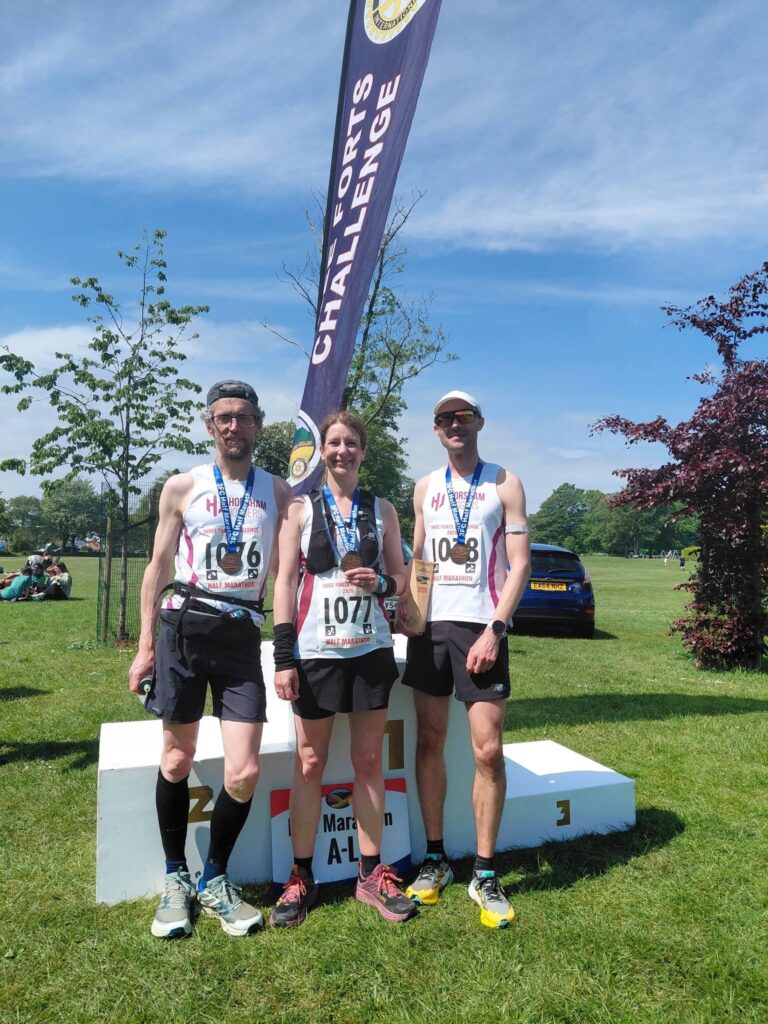 Three people in running gear