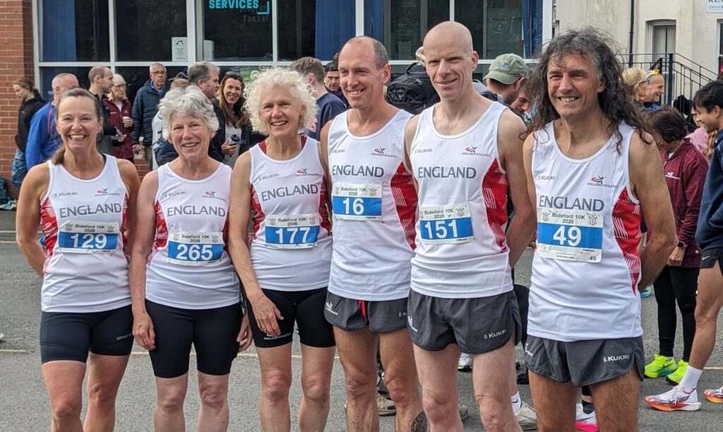 A group of six runners wearing running gear