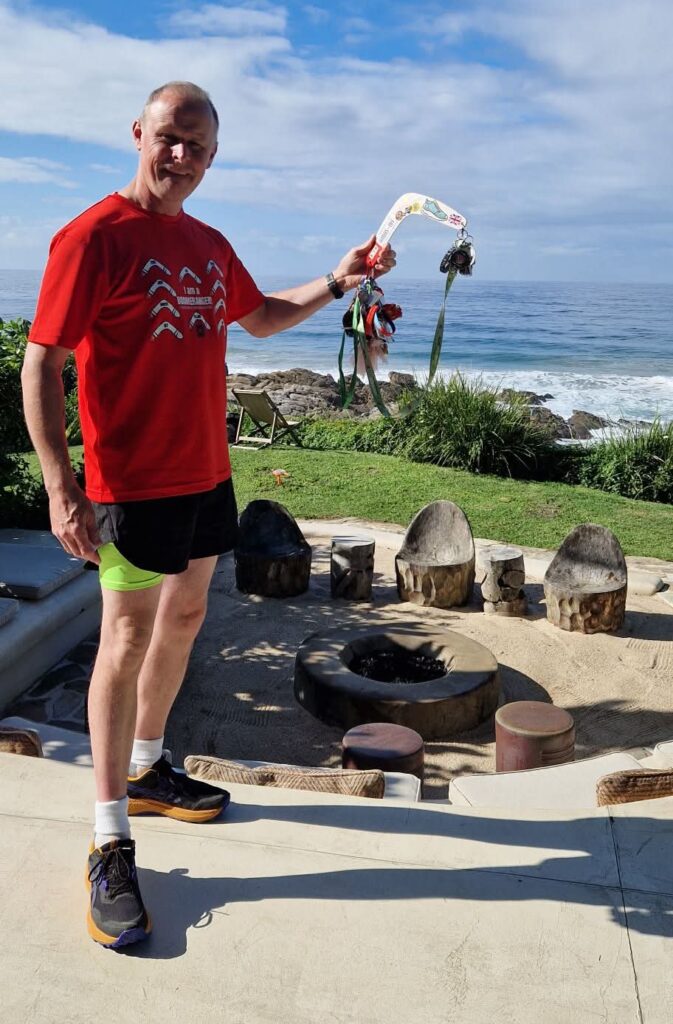 A man in red running shirt with a boomerang