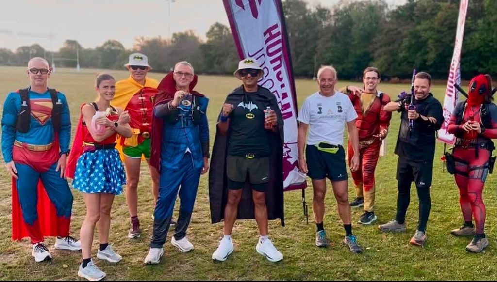 Stranger Loopers team of runners in their Superhero outfits
